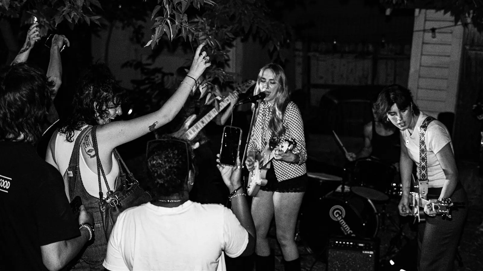 Lady Preacher playing a packed backyard show