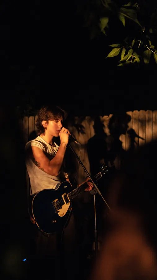 Lady Preacher singer with guitar at the mic