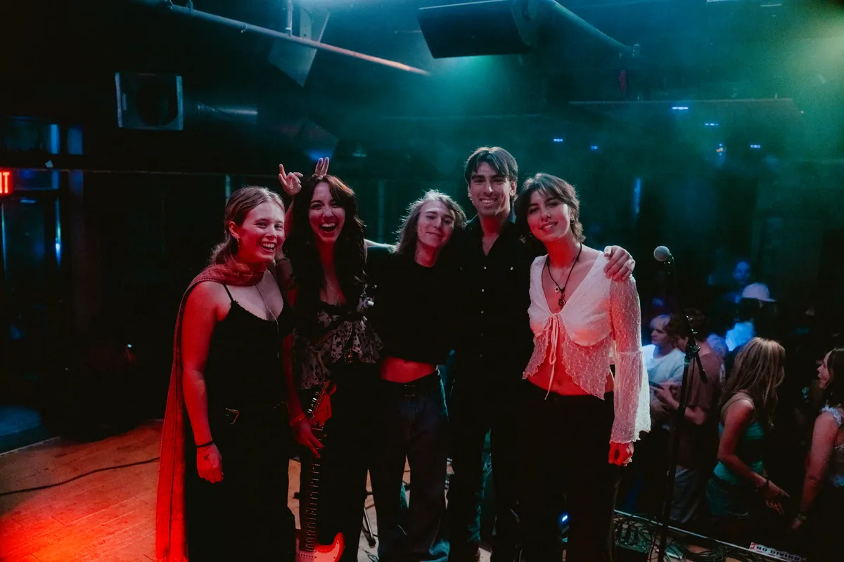 The whole band on stage after the Sound Bar show