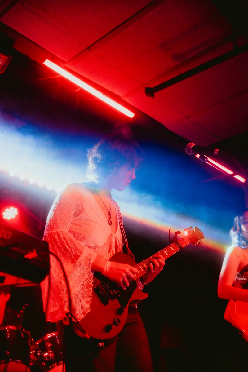 Gavriella under red and blue light