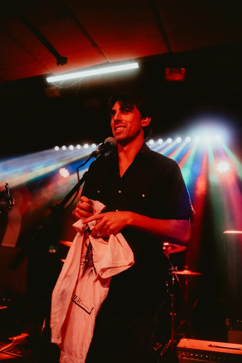Mateo at the mic between songs