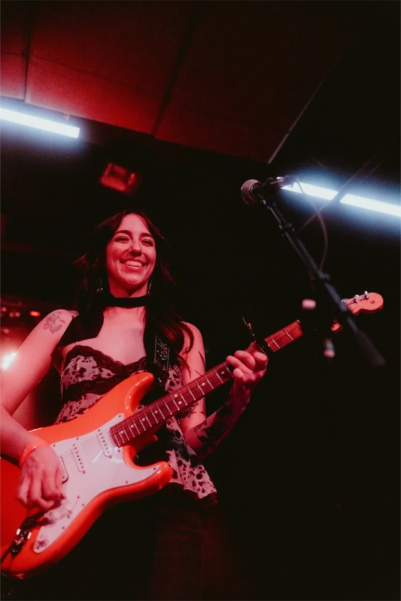 Lilah laughing at the mic