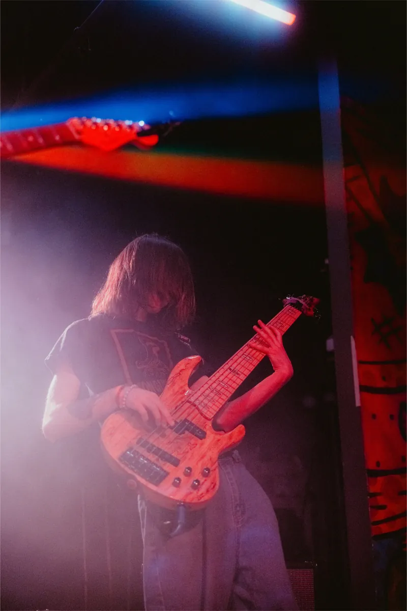 Gabe on bass in the stage haze